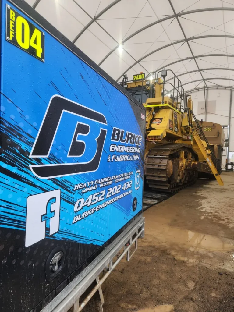 Burke Engineering machinery inside a workshop tent.