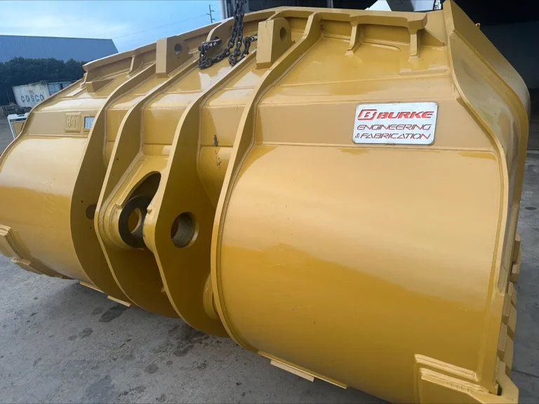 Yellow industrial machinery attachment